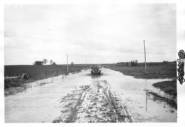 E.M.F. car on flooded road, on pathfinder tour for 1909 Glidden Tour