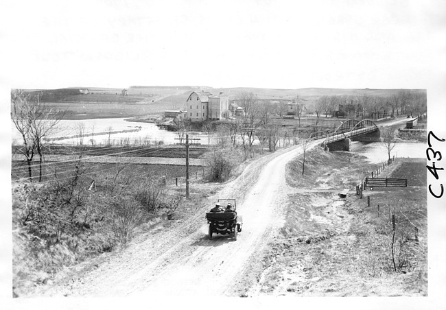 E.M.F. car approaching town, on pathfinder tour for 1909 Glidden Tour