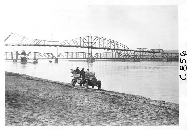 E.M.F. car on shore by bridge, on pathfinder tour for 1909 Glidden Tour
