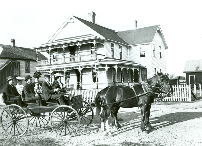 Andrew Rian family in front of the Rian Hotel in Metropolitan (now Felch)