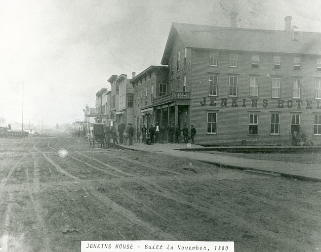 View of the east side of the 200 block of Stephenson Avenue, facing north, the Jenkins Hotel in fore