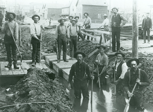 Iron Mountain city workers 'boxing in' the mine creek on West Hughitt Street