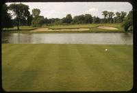 Tee to green view of the 12th Hole at the Milwaukee Country Club, Wisconsin, looking across the Milwaukee River, 1956