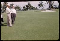 Hole #11 approach and green at the Indian Creek Country Club, Florida, 1953, with Red Lawerence speaking with C. C. Shaw