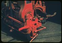 Mid-range view of a Toro mower with a chrome moly front catcher bracket, 1953