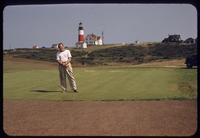 Sam Swazy on the turf nursery at Sankaty Head Golf Club, Nantucket Island, Massachusetts, 1953, with lighthouse in background